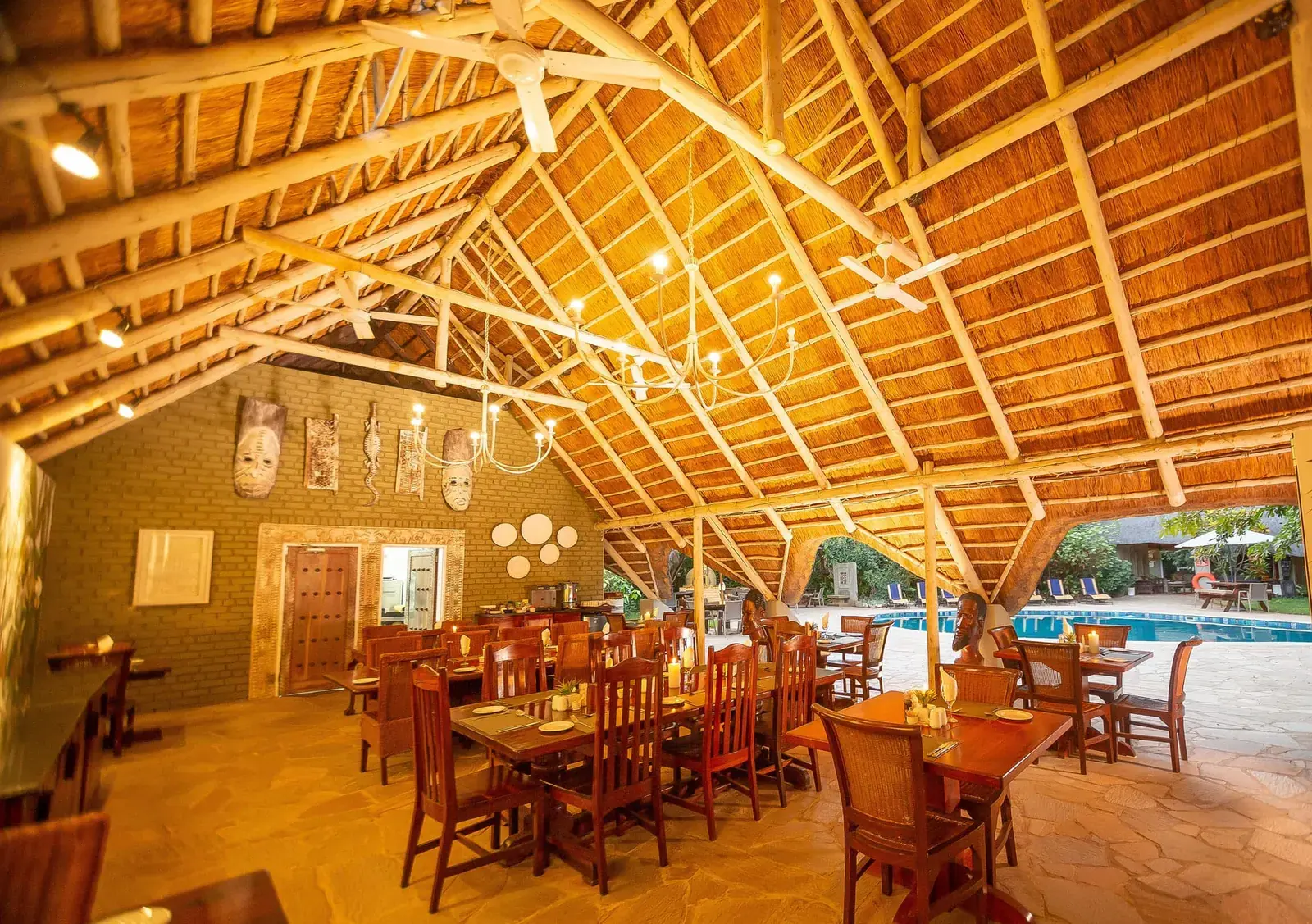 Thatched dining boma at Bayete Guest Lodge