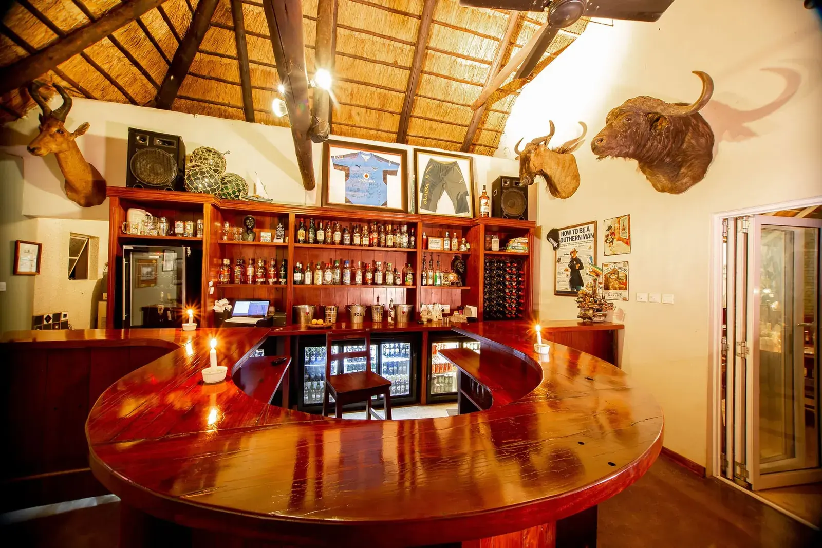 Bar at Bayete Guest Lodge under a thatched roof
