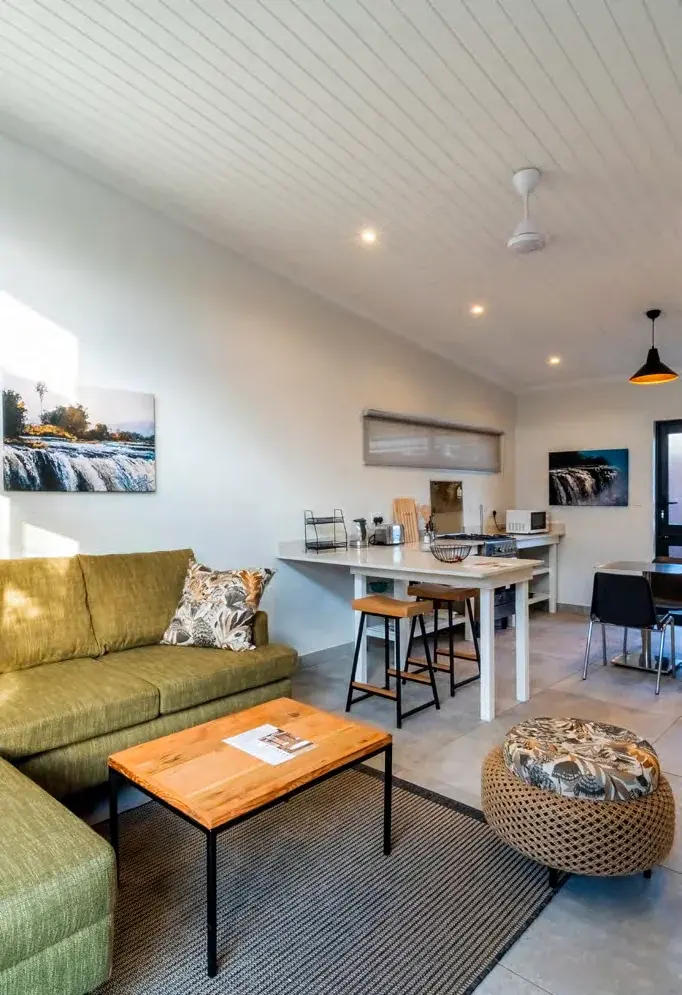 Open-plan lounge and kitchen inside a pod