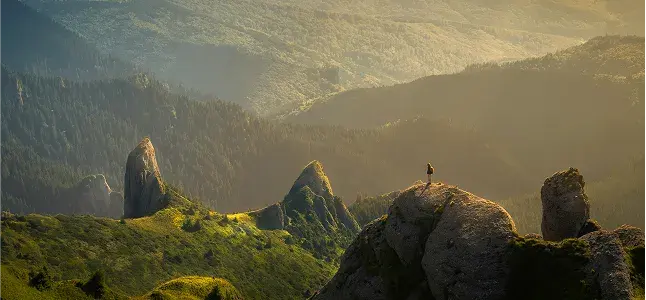 Mountain valley with rock pillars at sunrise