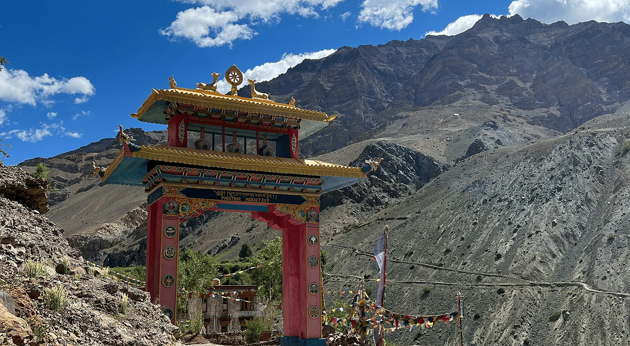 Ornate painted gateway in a dry mountain valley