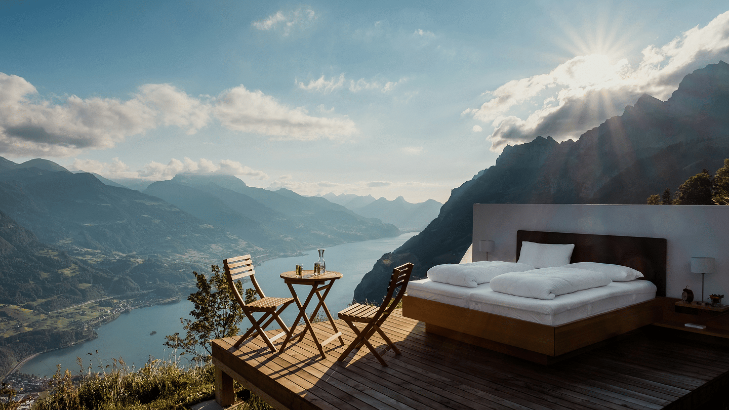 Bedroom balcony looking over a lake and mountains